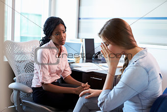 Doctor In Consultation With Depressed Female Patient