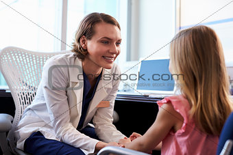 Pediatrician Talking To Child In Hospital