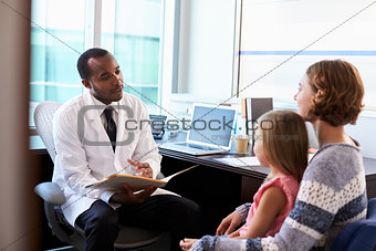 Pediatrician Meeting With Mother And Child In Hospital
