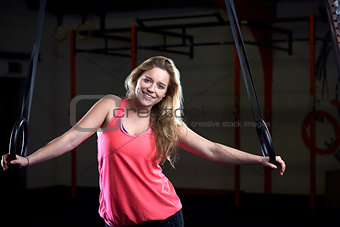 Portrait Of Young Woman In Gym With Olympic Rings