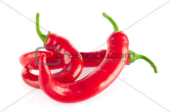 Three organic red hot chili peppers.