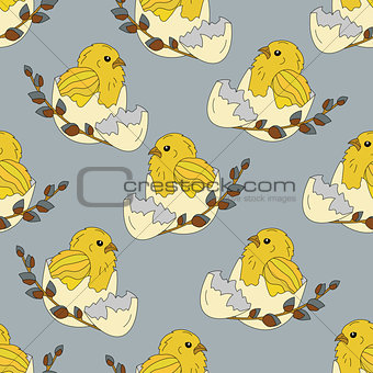 Seamless pattern with chickens in the egg shell and a sprig of willow
