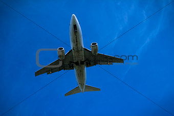 Jet airplane flying overhead close-up