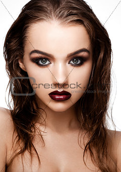 Beauty smokey eyes red lips makeup wet hair model