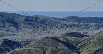 Crimean barrows on a background of mountains, sea and sky