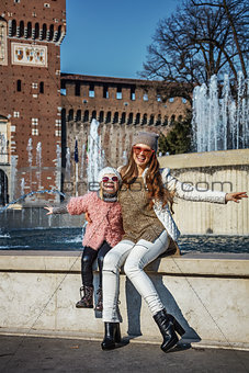 mother and child tourists near Sforza Castle having fun time