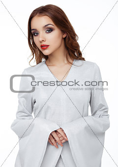 Beautiful fashion model wearing silver dress