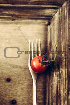 Fork and tomato