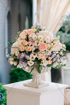 Beautiful wedding bouquet in stone vase, closeup