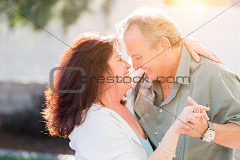 Middle Aged Couple Enjoy A Romantic Slow Dance Outside