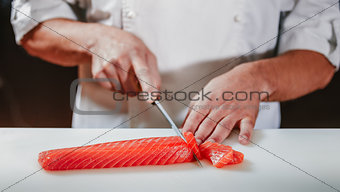 Preparing sashimi set in restaurant kitchen