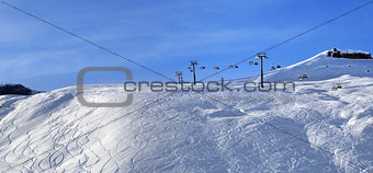Panoramic view on sunlight off-piste slope at morning