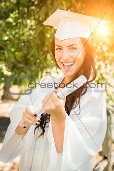 Graduating Mixed Race Girl In Cap and Gown with Diploma