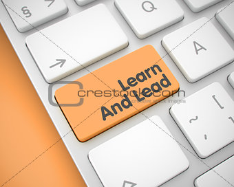 Learn And Lead - Message on the Orange Keyboard Keypad. 3D.