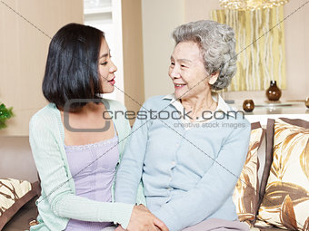 senior mother and adult daughter