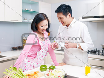 young couple in kitchen