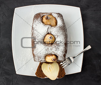 Whole Chocolate cake with pear and one piece of it