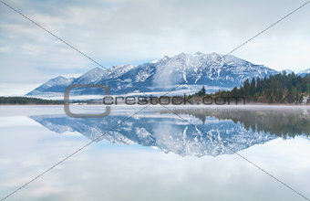 mountain range reflected in Barmsee lake