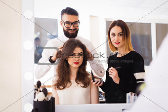 beauty salon, makeup and styling in the salon, hairdressers and make-up artist,