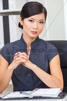 Asian Chinese Woman or Businesswoman in her Office