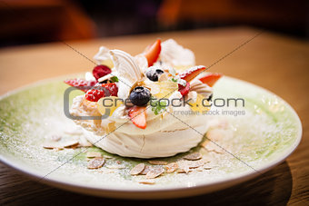 Pavlova, a home made cake from layers of meringue