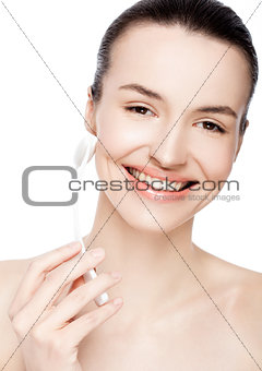 Beauty girl holding drainage massage face roller