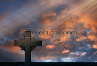 Sunset rays over iron cross