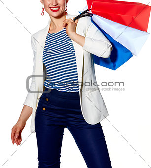Closeup on happy woman with French flag colours shopping bags