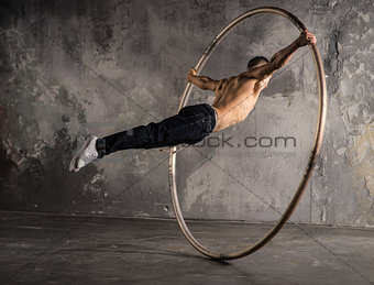 Circus artist in aCyr Wheel
