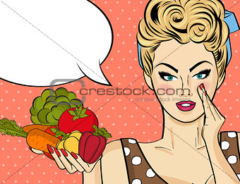 Sexy blonde woman with many vegetables in his hands