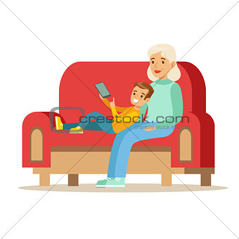 Grandmother And Boy Reading Electronic Book, Part Of Grandparents Having Fun With Grandchildren Series