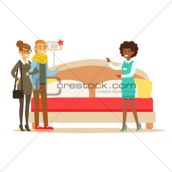 Store Seller Demonstrating King Size Bed To Couple, Smiling Shopper In Furniture Shop Shopping For House Decor Elements