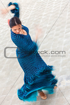 Motion Blur Shot of Traditional Woman Spanish Flamenco Dancer