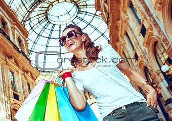 Fashion monger with shopping bags in Galleria Vittorio Emanuele