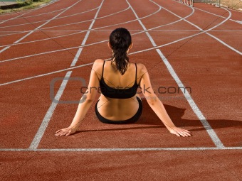 young woman at stadium track