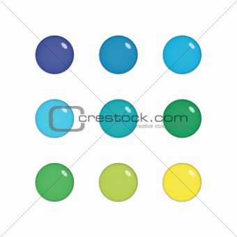 Nine glass orbs in green, blue and yellow
