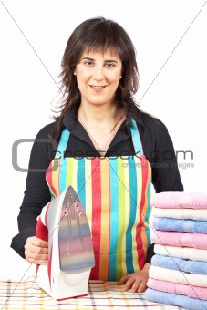 Housewife close to towels stacked