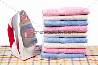 Electric iron and towels stacked
