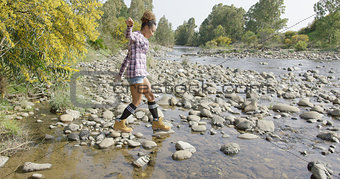 Female tourist walking on rocks