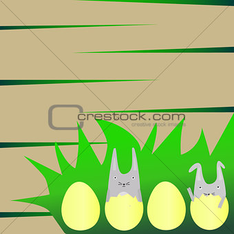 Cute Rabbits in Yellow Eggs on Grass