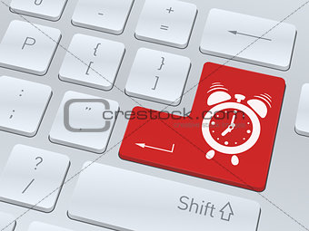 Alarm clock concept on button of white computer keyboard.