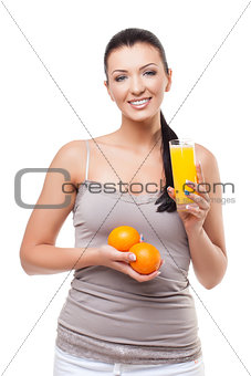 Beautiful girl with oranges and orange juice