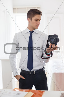 The photographer takes a photo of himself in the mirror