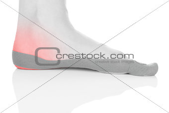 Therapeutic tape on female heel.