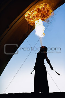 Fire artist performing extreme fire breathing
