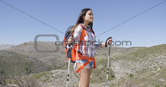 Attractive female traveller with backpack
