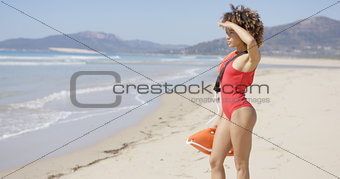 Female looking into distance on beach