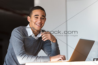 Happy young man with laptop