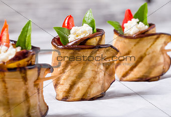 delicious Eggplant Rolls with feta cheese, tomato and basil leav