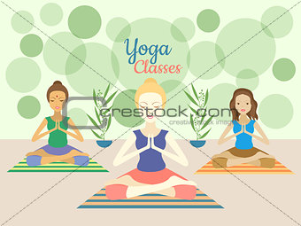 Three beautiful women practicing yoga exercises in gym